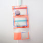 Pochette orange / bleue